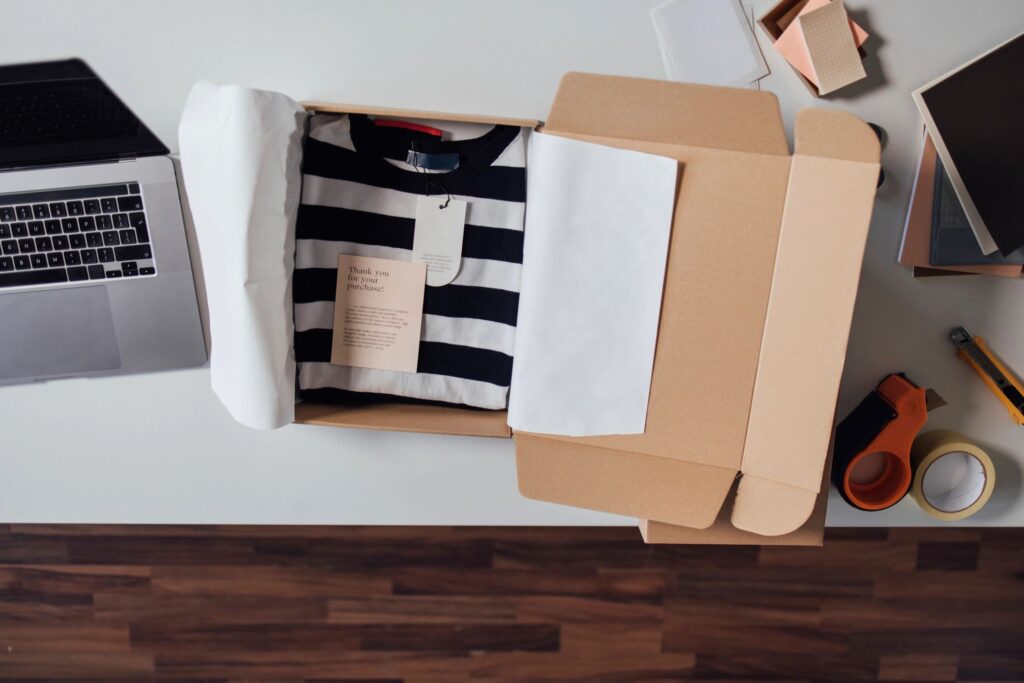 From Above View of an Open Box with Clothes Prepared to Be Sent