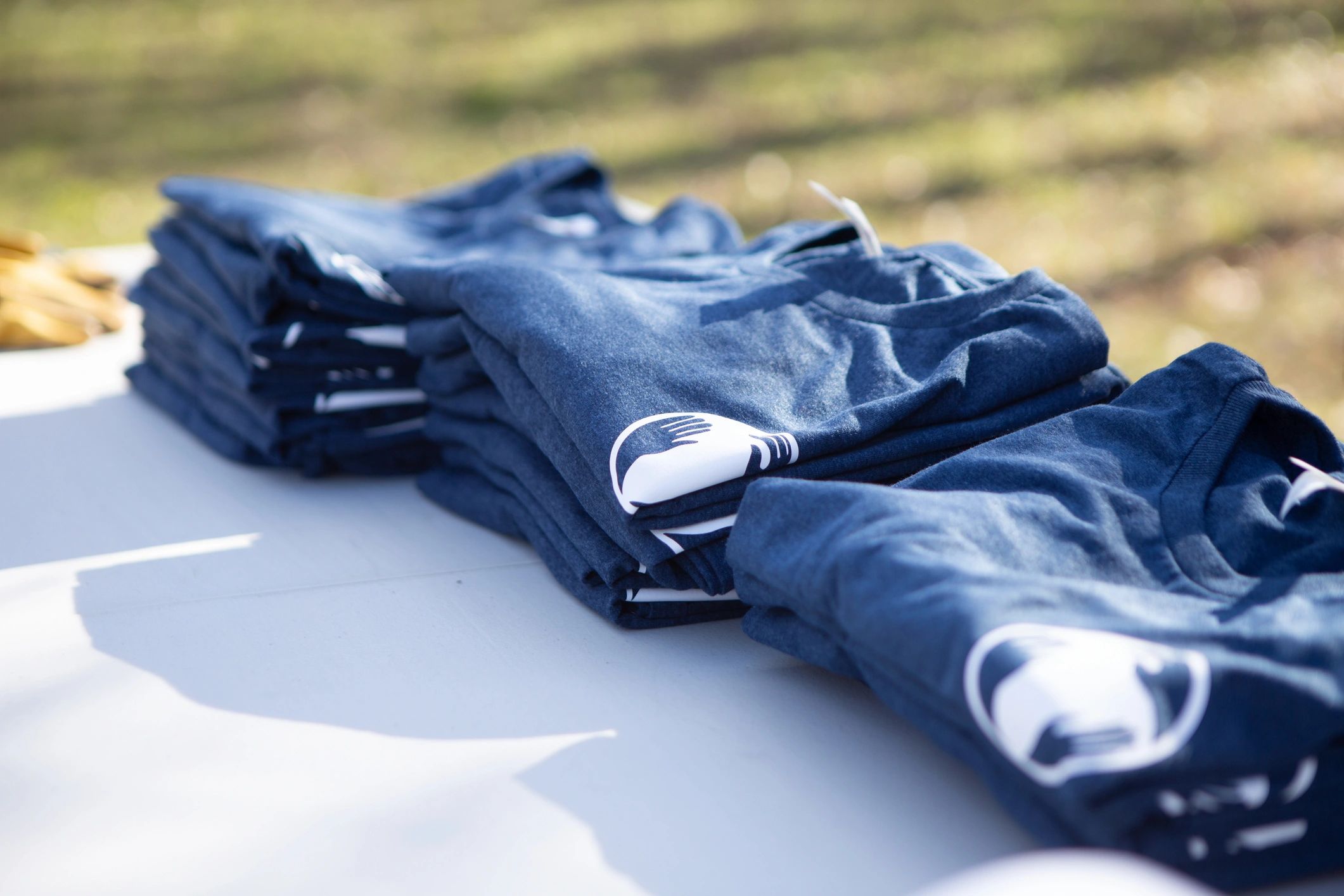 Stacks of folded t-shirts ready for packing and shipping